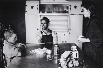David Goldblatt, A Plot-Holder and their Eldest Son at Lunch, Wheatlands Plots, near Randfontein, 1962, gelatin silver print, 30.5 x 46.5 cm, © David Goldblatt, courtesy Howard Greenberg Gallery David Goldblatt, A Plot-Holder and their Eldest Son at Lunch, Wheatlands Plots, near Randfontein, 1962, gelatin silver print, 30.5 x 46.5 cm, © David Goldblatt, courtesy Howard Greenberg Gallery