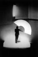 Anderson Playing the Neon Bow, 1983, black and white photograph from 'United States, 1-4' at Brooklyn Academy of Music, Brooklyn, NY Anderson Playing the Neon Bow, 1983, black and white photograph from 'United States, 1-4' at Brooklyn Academy of Music, Brooklyn, NY