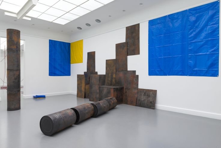 Sheela Gowda, Kagebangara, 2008, flattened tar drum sheets, tar drums, mica tar sheet, mica, tarpaulin, dimensions variable, Installation view at Van Abbemuseum, 2013, Image Courtesy: The Artist and GALLERYSKE, © Peter Cox Sheela Gowda, Kagebangara, 2008, flattened tar drum sheets, tar drums, mica tar sheet, mica, tarpaulin, dimensions variable, Installation view at Van Abbemuseum, 2013, Image Courtesy: The Artist and GALLERYSKE, © Peter Cox