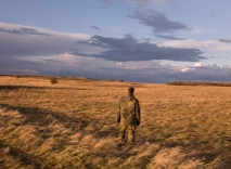 Almut Linde, Dirty Minimal Action #52.2 — Landscape (detail), colour photograph, diptych, 318 x 206 cm, 2008, undisclosed military unit. During a break from shooting practice, a soldier was asked to behold the landscape.